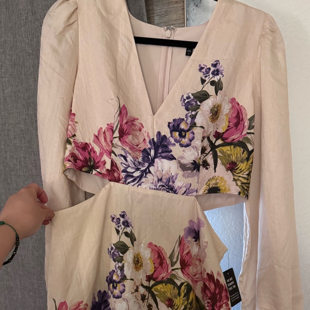 Flowery/beige dress very cute to pair up with some cowgirl boots.